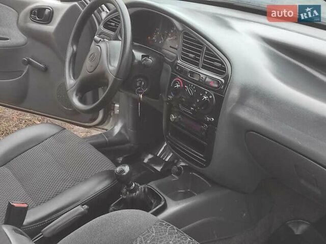 Серый Дэу Ланос, объемом двигателя 1.5 л и пробегом 156 тыс. км за 1950 $, фото 4 на Automoto.ua