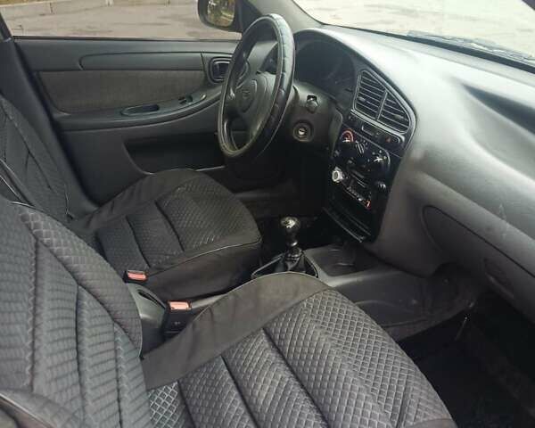 Серый Дэу Ланос, объемом двигателя 1.5 л и пробегом 224 тыс. км за 2400 $, фото 2 на Automoto.ua