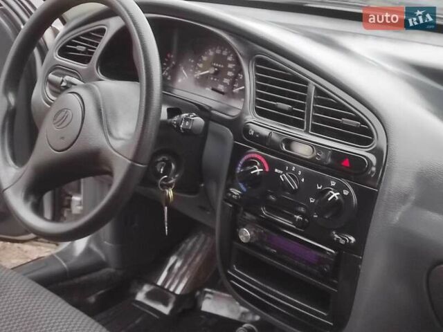 Серый Дэу Ланос, объемом двигателя 1.5 л и пробегом 156 тыс. км за 1950 $, фото 6 на Automoto.ua