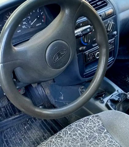 Сірий Деу Ланос, об'ємом двигуна 1.5 л та пробігом 220 тис. км за 1450 $, фото 3 на Automoto.ua