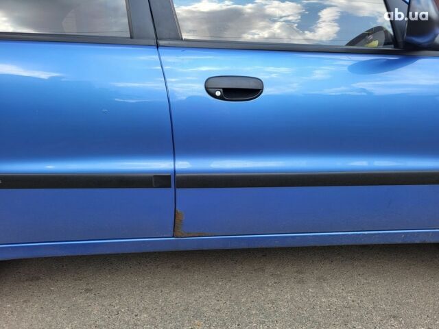 Синий Дэу Ланос, объемом двигателя 0 л и пробегом 190 тыс. км за 3300 $, фото 4 на Automoto.ua