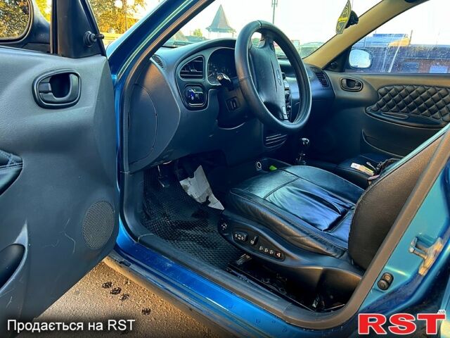 Синий Дэу Ланос, объемом двигателя 1.5 л и пробегом 328 тыс. км за 1600 $, фото 7 на Automoto.ua