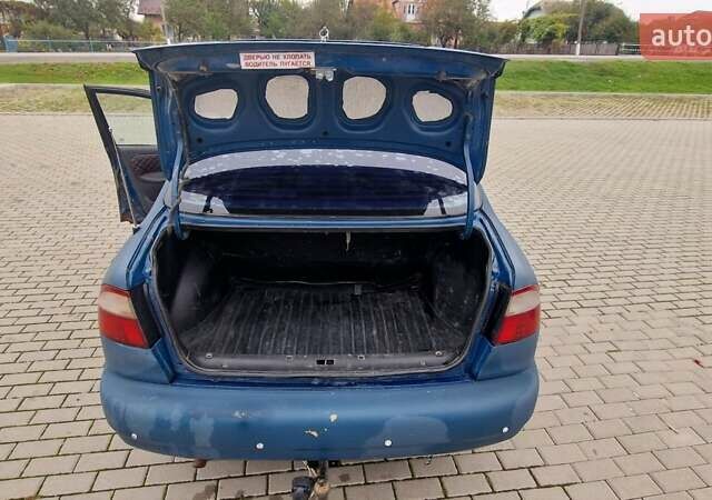 Синій Деу Ланос, об'ємом двигуна 1.5 л та пробігом 560 тис. км за 1100 $, фото 11 на Automoto.ua
