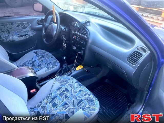 Синий Дэу Ланос, объемом двигателя 1.5 л и пробегом 240 тыс. км за 2300 $, фото 2 на Automoto.ua
