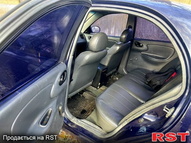 Синий Дэу Ланос, объемом двигателя 1.5 л и пробегом 375 тыс. км за 1750 $, фото 2 на Automoto.ua