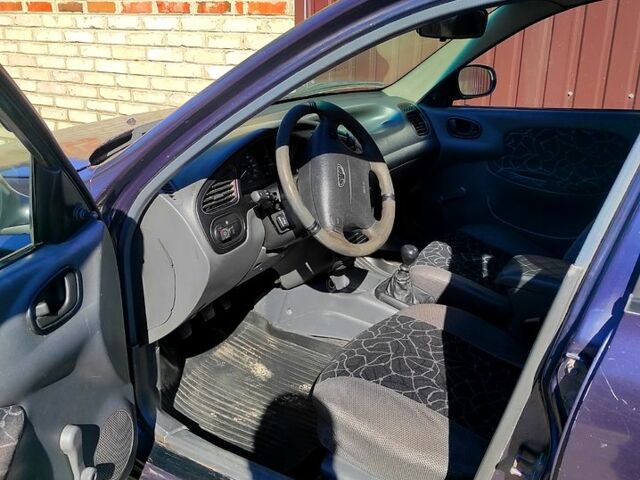 Синий Дэу Ланос, объемом двигателя 1.5 л и пробегом 220 тыс. км за 1400 $, фото 4 на Automoto.ua