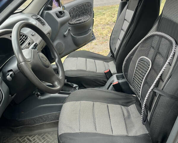 Синий Дэу Ланос, объемом двигателя 1.5 л и пробегом 220 тыс. км за 2300 $, фото 12 на Automoto.ua