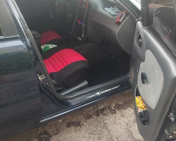 Синий Дэу Ланос, объемом двигателя 1.5 л и пробегом 215 тыс. км за 3100 $, фото 12 на Automoto.ua