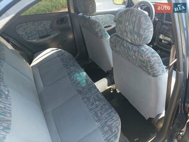 Синий Дэу Ланос, объемом двигателя 1.5 л и пробегом 224 тыс. км за 1999 $, фото 3 на Automoto.ua