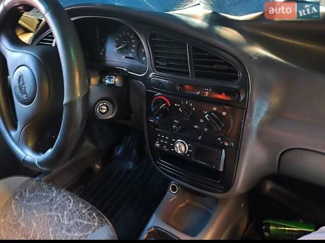 Синий Дэу Ланос, объемом двигателя 1.5 л и пробегом 228 тыс. км за 1650 $, фото 11 на Automoto.ua