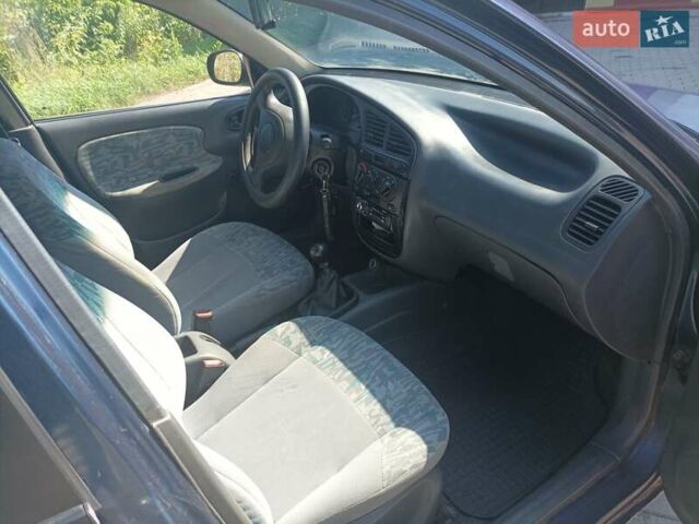 Синий Дэу Ланос, объемом двигателя 1.5 л и пробегом 224 тыс. км за 1999 $, фото 4 на Automoto.ua