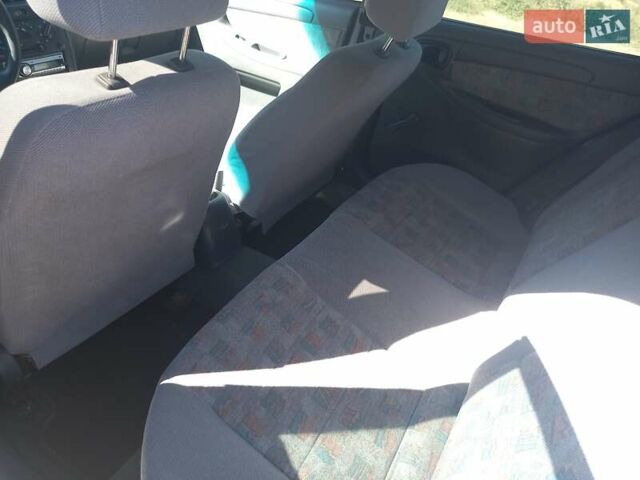 Синий Дэу Ланос, объемом двигателя 1.5 л и пробегом 304 тыс. км за 3500 $, фото 19 на Automoto.ua