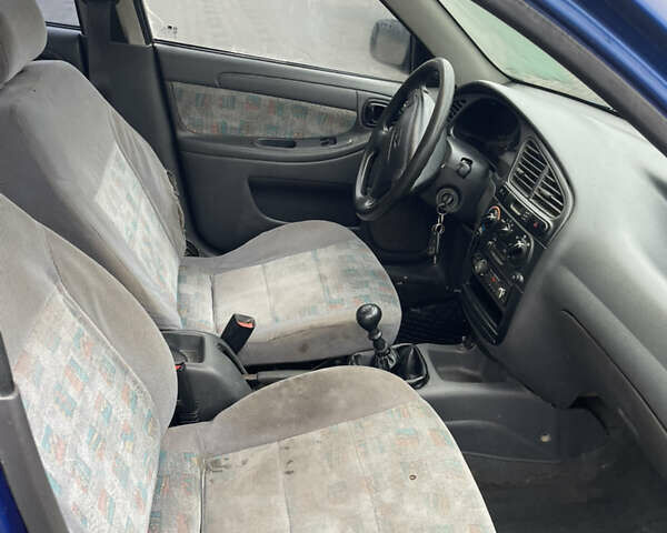 Синий Дэу Ланос, объемом двигателя 1.5 л и пробегом 330 тыс. км за 1399 $, фото 5 на Automoto.ua