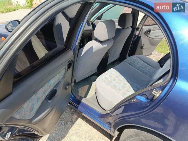 Деу Ланос 2005 у Глухове на Automoto.ua Синій Деу Ланос, об'ємом двигуна 1.5 л та пробігом 251 тис. км за 2900 $, фото 11 на Automoto.ua
