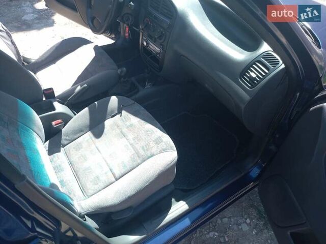 Синий Дэу Ланос, объемом двигателя 1.5 л и пробегом 304 тыс. км за 3500 $, фото 13 на Automoto.ua