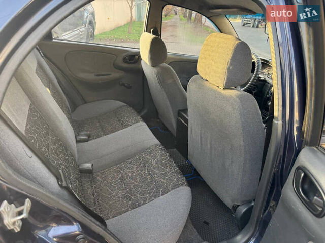 Синій Деу Ланос, об'ємом двигуна 1.5 л та пробігом 300 тис. км за 1999 $, фото 9 на Automoto.ua