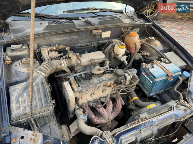 Синій Деу Ланос, об'ємом двигуна 1.5 л та пробігом 300 тис. км за 1999 $, фото 13 на Automoto.ua