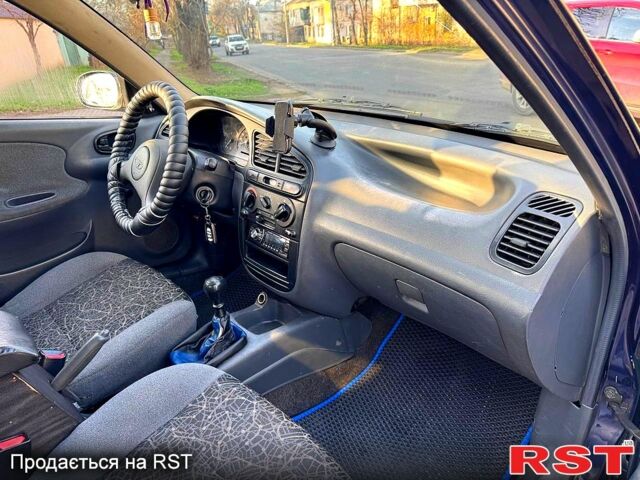 Синій Деу Ланос, об'ємом двигуна 1.5 л та пробігом 300 тис. км за 1999 $, фото 8 на Automoto.ua