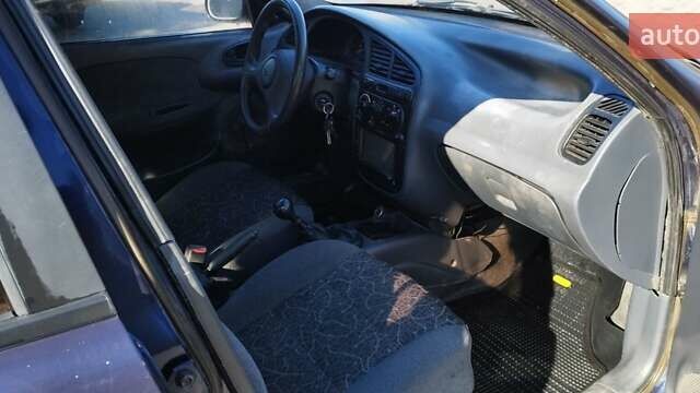 Синий Дэу Ланос, объемом двигателя 1.5 л и пробегом 300 тыс. км за 1150 $, фото 11 на Automoto.ua