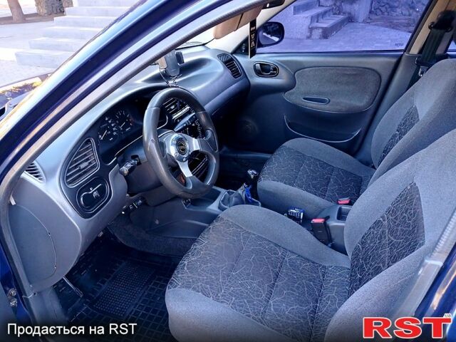 Синий Дэу Ланос, объемом двигателя 1.5 л и пробегом 217 тыс. км за 2100 $, фото 3 на Automoto.ua