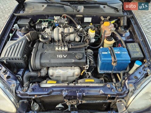 Синий Дэу Ланос, объемом двигателя 1.6 л и пробегом 125 тыс. км за 1600 $, фото 3 на Automoto.ua