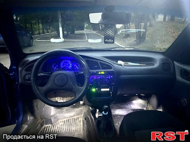 Синій Деу Ланос, об'ємом двигуна 1.4 л та пробігом 200 тис. км за 1999 $, фото 4 на Automoto.ua