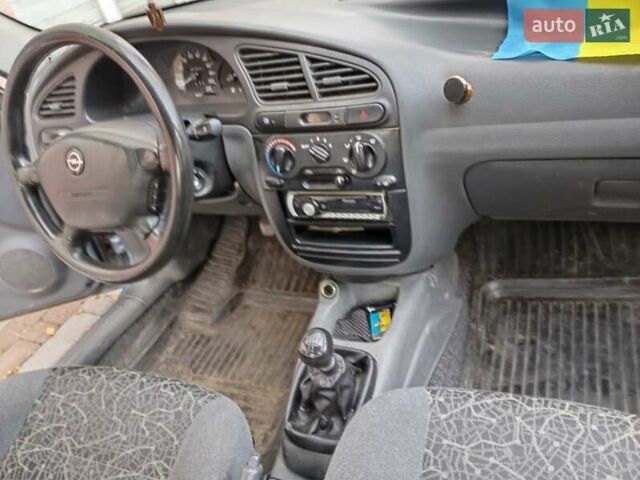 Синій Деу Ланос, об'ємом двигуна 1.39 л та пробігом 167 тис. км за 2400 $, фото 4 на Automoto.ua
