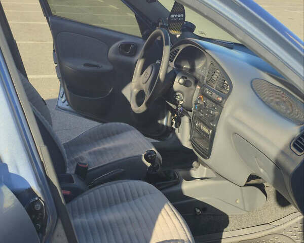 Синий Дэу Ланос, объемом двигателя 1.5 л и пробегом 318 тыс. км за 2700 $, фото 5 на Automoto.ua