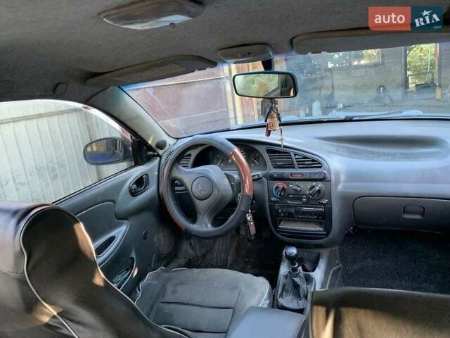 Синий Дэу Ланос, объемом двигателя 1.5 л и пробегом 100 тыс. км за 2000 $, фото 4 на Automoto.ua