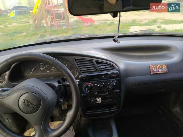 Синий Дэу Ланос, объемом двигателя 1.5 л и пробегом 200 тыс. км за 800 $, фото 15 на Automoto.ua