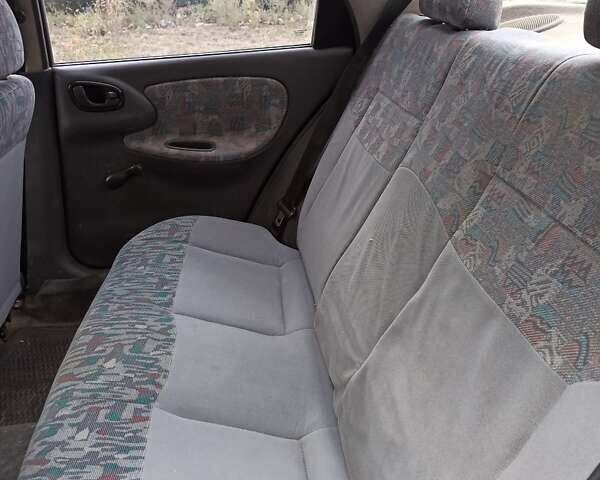 Зеленый Дэу Ланос, объемом двигателя 1.5 л и пробегом 280 тыс. км за 1400 $, фото 4 на Automoto.ua