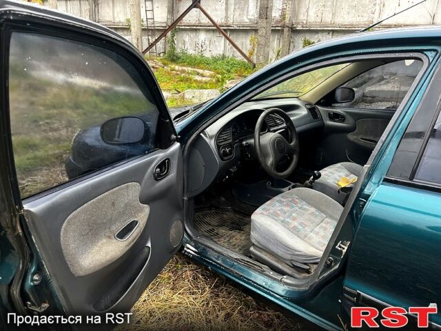 Зеленый Дэу Ланос, объемом двигателя 1.5 л и пробегом 200 тыс. км за 1400 $, фото 7 на Automoto.ua