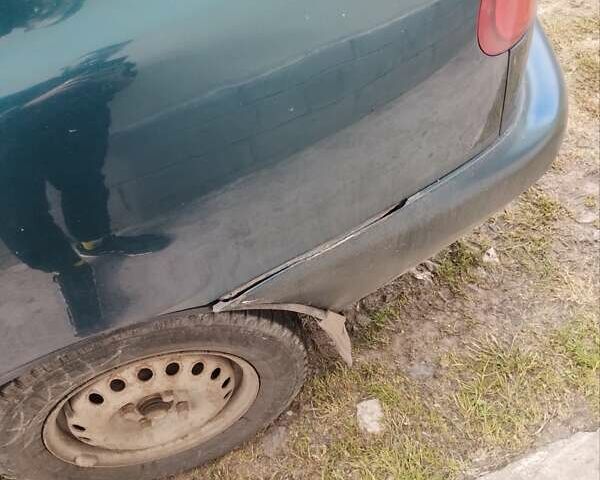 Зеленый Дэу Ланос, объемом двигателя 1.5 л и пробегом 303 тыс. км за 1000 $, фото 5 на Automoto.ua