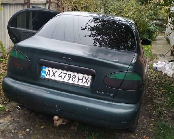 Деу Ланос 2003 у Люботине на Automoto.ua Зелений Деу Ланос, об'ємом двигуна 1.5 л та пробігом 200 тис. км за 2000 $, фото 1 на Automoto.ua