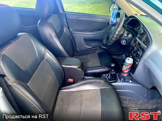 Зеленый Дэу Ланос, объемом двигателя 1.5 л и пробегом 270 тыс. км за 3000 $, фото 4 на Automoto.ua