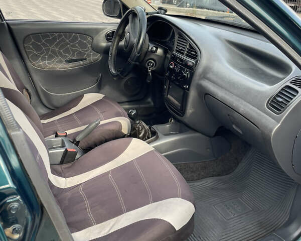 Зеленый Дэу Ланос, объемом двигателя 1.5 л и пробегом 310 тыс. км за 1300 $, фото 22 на Automoto.ua