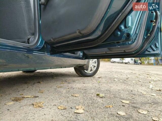 Дэу Ланос 2003 в Запорожье на Automoto.ua Зеленый Дэу Ланос, объемом двигателя 1.5 л и пробегом 97 тыс. км за 3300 $, фото 14 на Automoto.ua