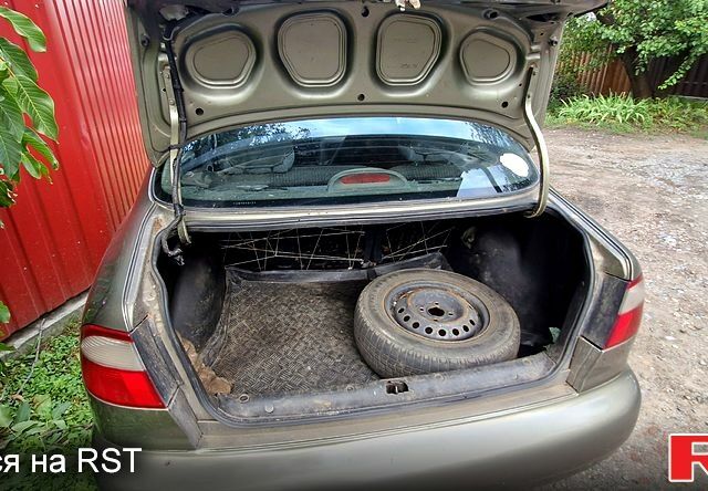 Дэу Ланос 2003 в Славянске на Automoto.ua Зеленый Дэу Ланос, объемом двигателя 1.5 л и пробегом 450 тыс. км за 1100 $, фото 2 на Automoto.ua