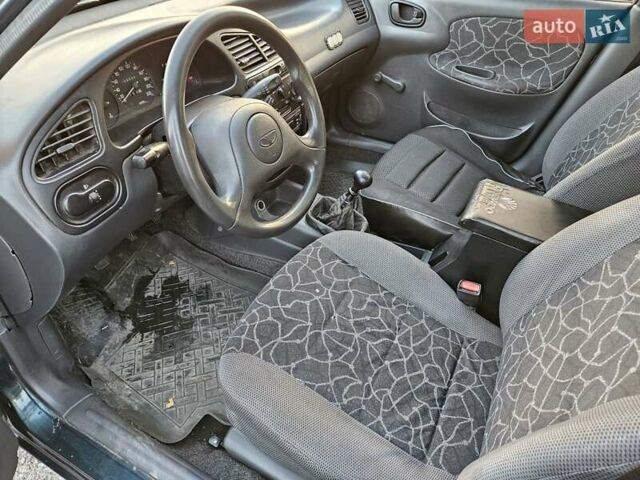 Зеленый Дэу Ланос, объемом двигателя 1.5 л и пробегом 296 тыс. км за 3000 $, фото 9 на Automoto.ua