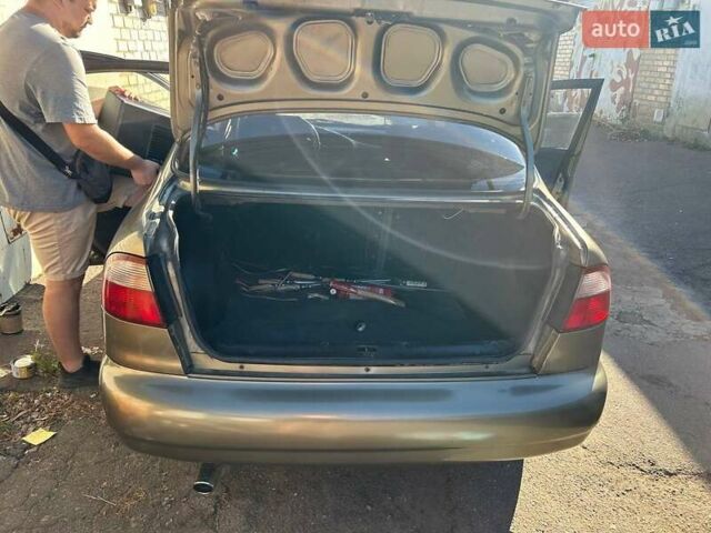 Зеленый Дэу Ланос, объемом двигателя 1.6 л и пробегом 350 тыс. км за 3000 $, фото 3 на Automoto.ua