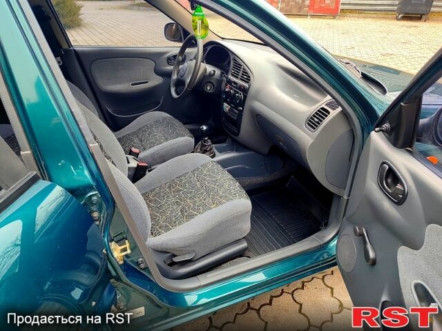 Зеленый Дэу Ланос, объемом двигателя 1.5 л и пробегом 185 тыс. км за 2750 $, фото 6 на Automoto.ua