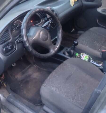 Зеленый Дэу Ланос, объемом двигателя 1.5 л и пробегом 283 тыс. км за 1950 $, фото 3 на Automoto.ua