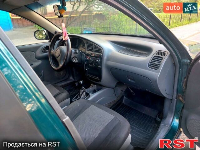 Зелений Деу Ланос, об'ємом двигуна 1.5 л та пробігом 257 тис. км за 2400 $, фото 4 на Automoto.ua