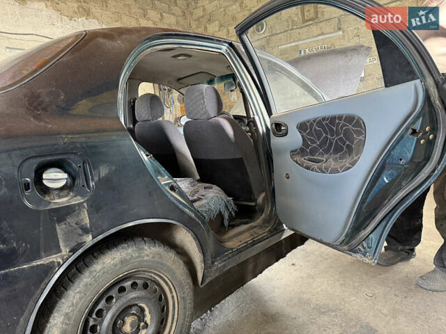 Зеленый Дэу Ланос, объемом двигателя 1.5 л и пробегом 104 тыс. км за 1850 $, фото 5 на Automoto.ua