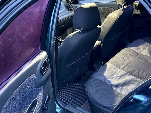 Зеленый Дэу Ланос, объемом двигателя 1.5 л и пробегом 330 тыс. км за 1550 $, фото 6 на Automoto.ua