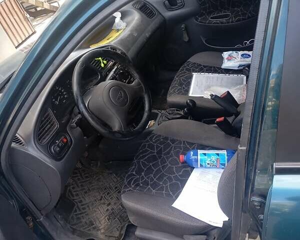 Зелений Деу Ланос, об'ємом двигуна 1.35 л та пробігом 245 тис. км за 900 $, фото 1 на Automoto.ua