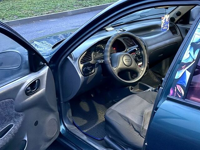 Зеленый Дэу Ланос, объемом двигателя 1.5 л и пробегом 330 тыс. км за 1550 $, фото 5 на Automoto.ua