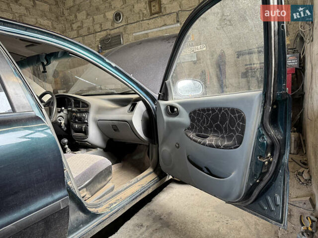 Зеленый Дэу Ланос, объемом двигателя 1.5 л и пробегом 104 тыс. км за 1850 $, фото 6 на Automoto.ua