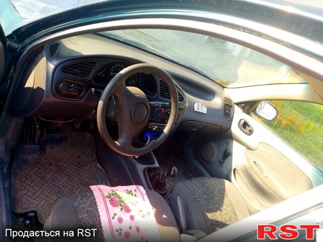 Зеленый Дэу Ланос, объемом двигателя 1.3 л и пробегом 100 тыс. км за 2500 $, фото 4 на Automoto.ua