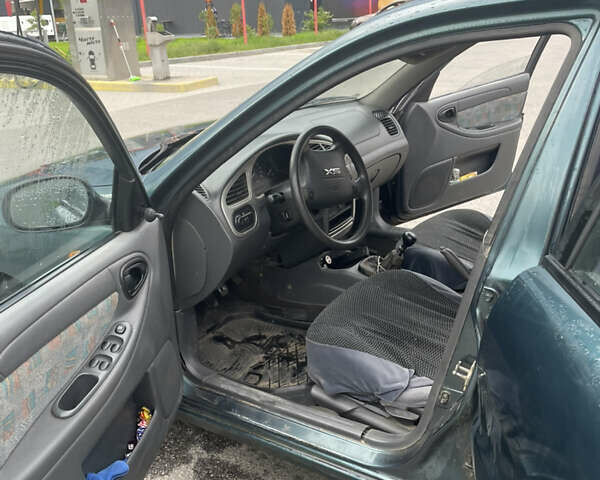 Зеленый Дэу Ланос, объемом двигателя 1.6 л и пробегом 233 тыс. км за 1900 $, фото 2 на Automoto.ua